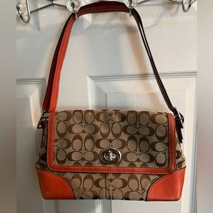 Authentic Coach mid size shoulder bag with signature CC pattern.
